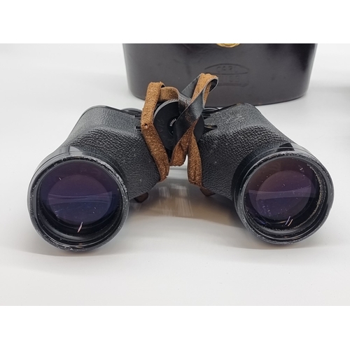 1397 - A pair of Carl Zeiss 8x50 B binoculars, in brown leather case; together with a Contaflex S camera, w... 