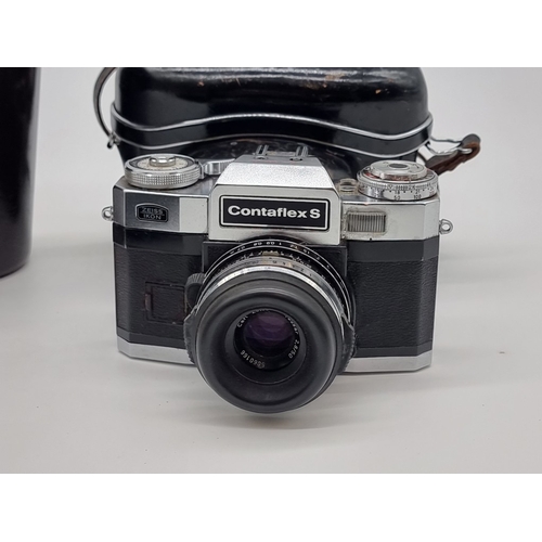 1397 - A pair of Carl Zeiss 8x50 B binoculars, in brown leather case; together with a Contaflex S camera, w... 