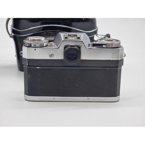 1397 - A pair of Carl Zeiss 8x50 B binoculars, in brown leather case; together with a Contaflex S camera, w... 