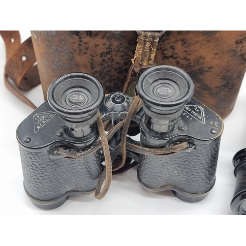 1398 - A pair of Goerz 8x binoculars, in leather case; together with a WWI brass compass, in tan leather ca... 