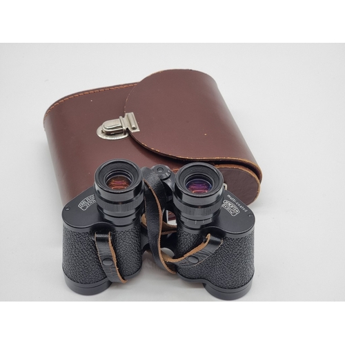 1399 - A pair of Carl Zeiss Jenoptem 8x30W binoculars, in leather case.