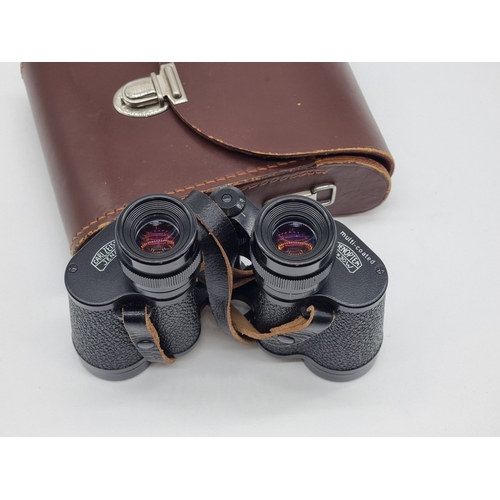 1399 - A pair of Carl Zeiss Jenoptem 8x30W binoculars, in leather case.