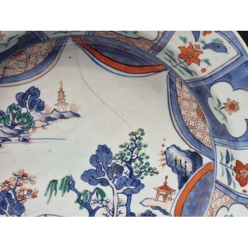 1413 - A Chinese Imari octagonal bowl, probably 18th century, 35.5cm diameter, (riveted).