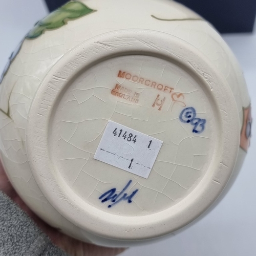 1445 - A Moorcroft 'Butterfly' pattern baluster vase, by Sally Tuffin, 16cm high, boxed, (crazed).... 