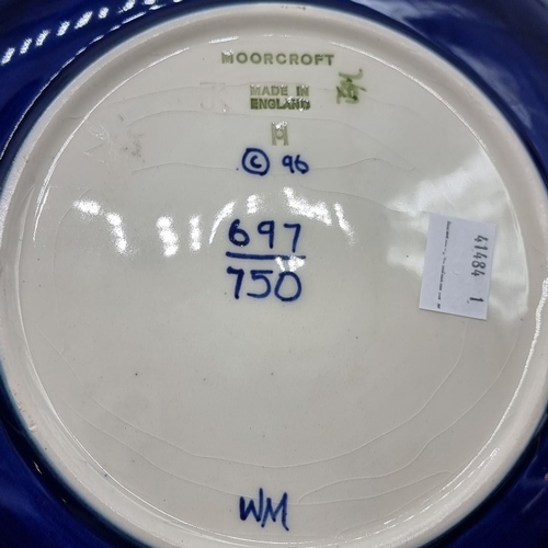 1447 - A Moorcroft '1997 Centenary' plate, No.697/750, 22.5cm diameter.