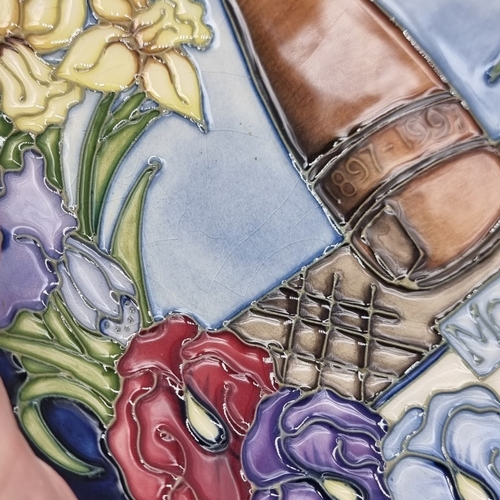 1447 - A Moorcroft '1997 Centenary' plate, No.697/750, 22.5cm diameter.