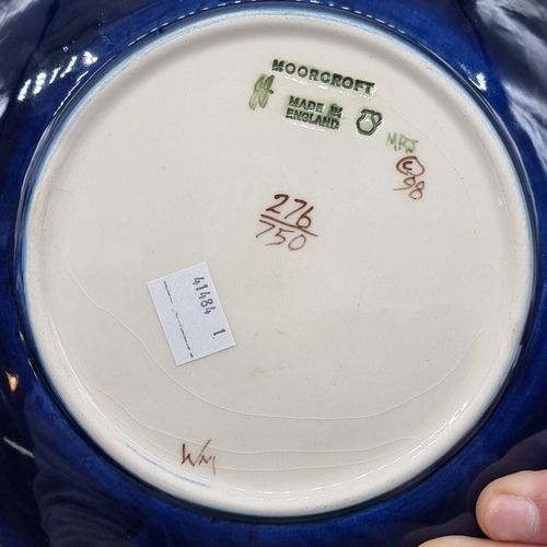 1448 - A Moorcroft '1999 Anna Lily' pattern plate, No.276/750, 22cm diameter, boxed.