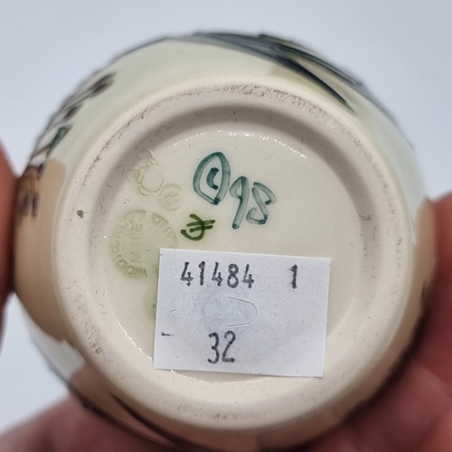 1450 - A Moorcroft 'Anna Lily' pattern vase, by Nicola Slaney, 13.5cm high, boxed.