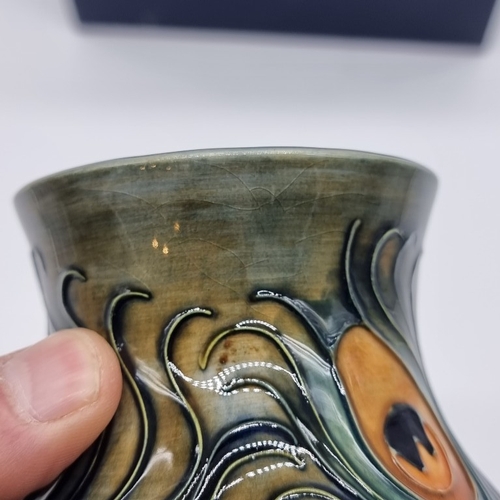 1453 - A Moorcroft 'Phoenix' pattern vase, by Rachel Bishop, 15.5cm high, boxed.