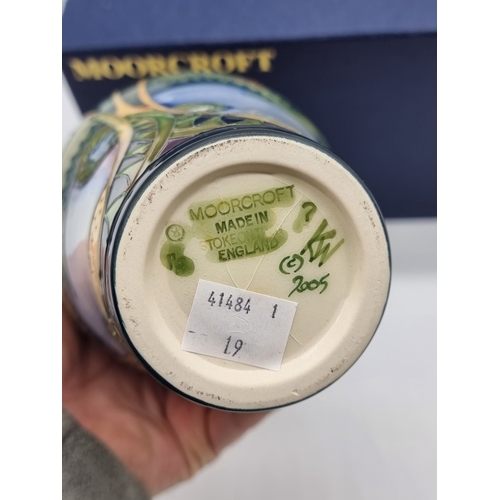 1454 - A Moorcroft 'Landscape Medley' pattern vase, 21cm high, (some crazing), boxed.