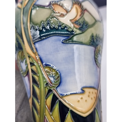 1454 - A Moorcroft 'Landscape Medley' pattern vase, 21cm high, (some crazing), boxed.