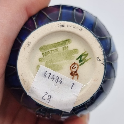 1460 - A Moorcroft 'Indigo' pattern vase, by Emma Bossons, 10cm high, boxed.