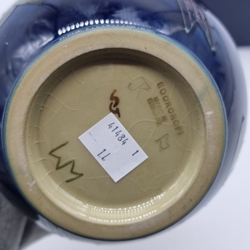 1462 - A Moorcroft 'Finches' pattern vase, 19cm high, (minor crazing), boxed.