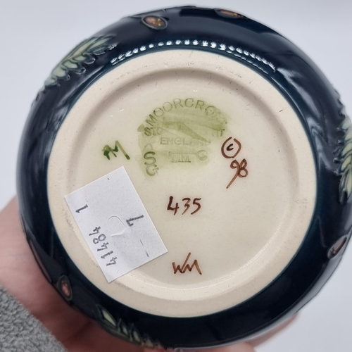 1465 - A Moorcroft 'Fiji' pattern bottle vase, No.435, by Emma Bossons, 20.5cm, boxed.