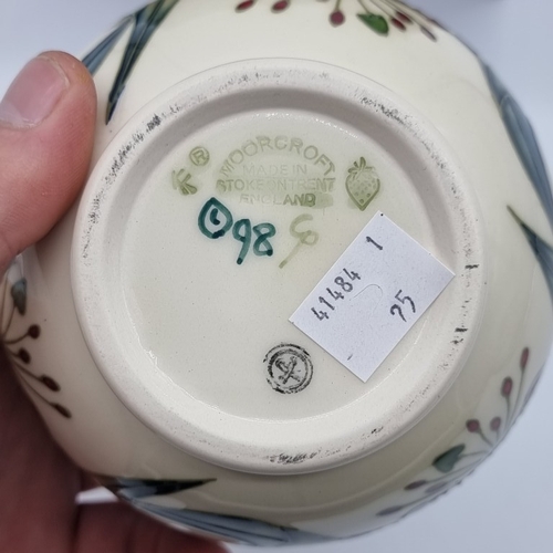 1467 - A Moorcroft 'Anna Lily' pattern ovoid vase, by Nicola Slaney, 11cm high, boxed.