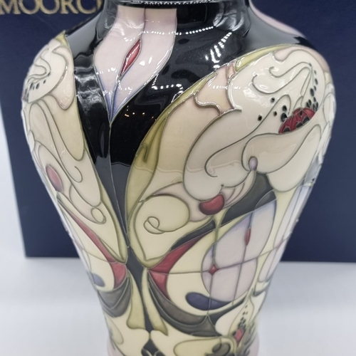 1471 - A Moorcroft 'White Rose' pattern vase, by Emma Bossons, signed, dated 2004 and numbered 16/300, 21.5... 