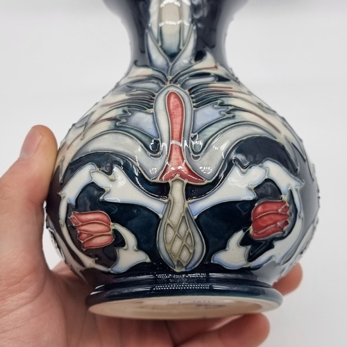 1475 - A Moorcroft 'Snakeshead' pattern baluster vase, 16cm high, boxed.