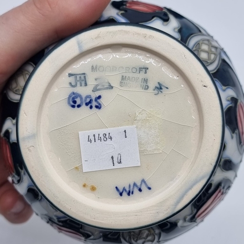 1475 - A Moorcroft 'Snakeshead' pattern baluster vase, 16cm high, boxed.