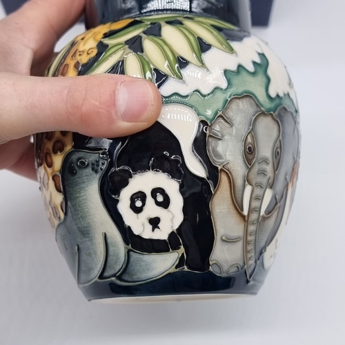 1477 - A Moorcroft 'Noah's Ark' pattern ginger jar and cover, by Rachel Bishop, 15.5cm high, boxed.... 