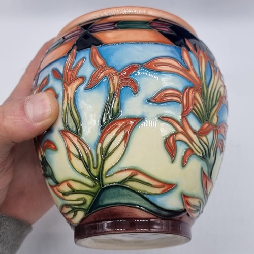1478 - A Moorcroft 'Indian Paintbrush' pattern jar and cover, 14.5cm high, boxed.