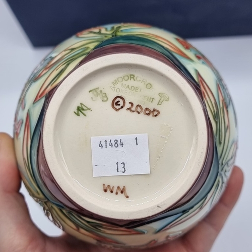 1478 - A Moorcroft 'Indian Paintbrush' pattern jar and cover, 14.5cm high, boxed.