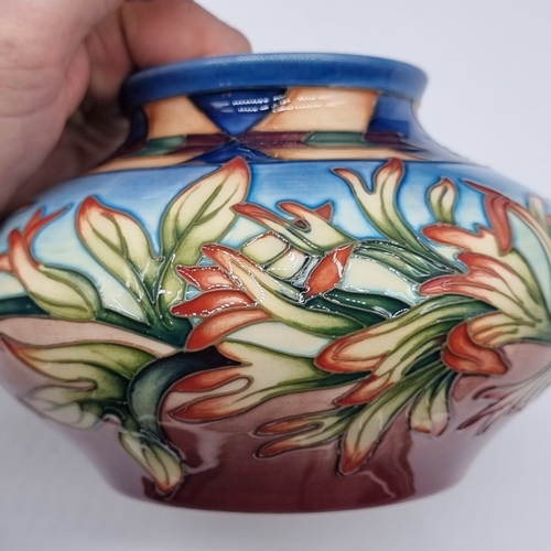 1480 - A Moorcroft 'Indian Paintbrush' pattern vase, 11.5cm high, boxed.