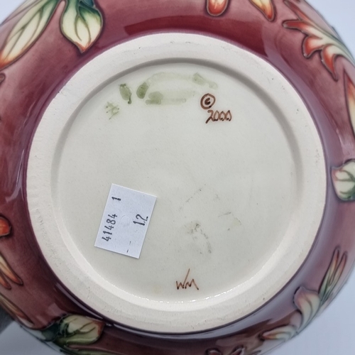 1480 - A Moorcroft 'Indian Paintbrush' pattern vase, 11.5cm high, boxed.