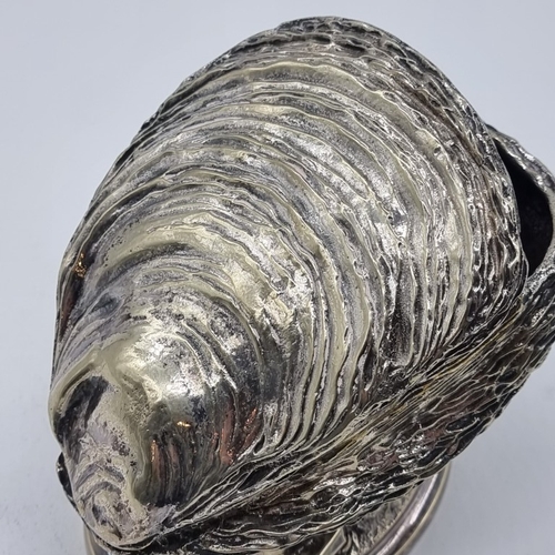 1518 - A silver plated oyster shell spoon warmer, 13cm high.