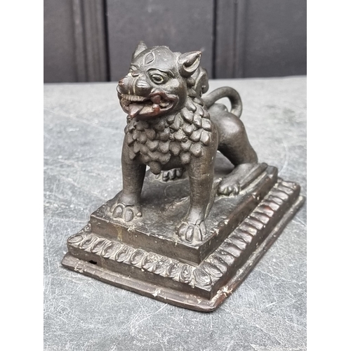 1521 - A Chinese bronze lion dog, 13cm long.