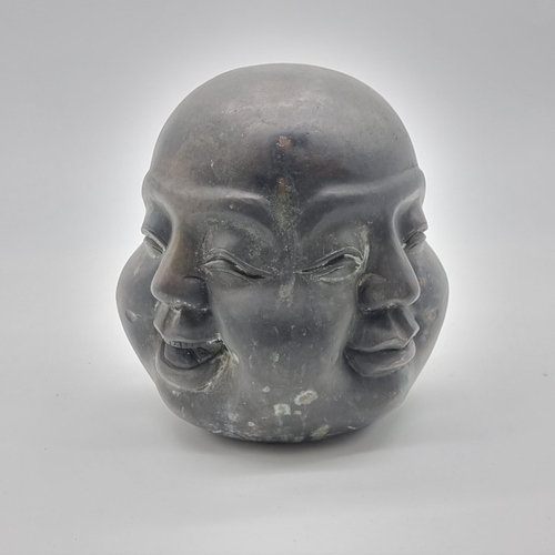 1526 - A bronze four faced Buddha head, seal mark to base, 20.5cm high.