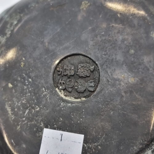 1526 - A bronze four faced Buddha head, seal mark to base, 20.5cm high.