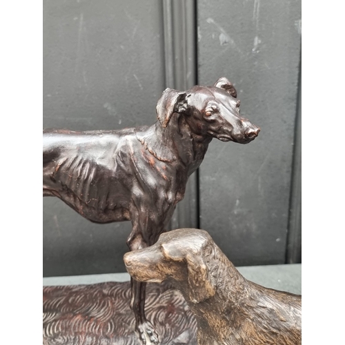 1531 - A pair of bronze Borzoi, 26cm long; together with another bronze dogs head, 22cm high; together with... 