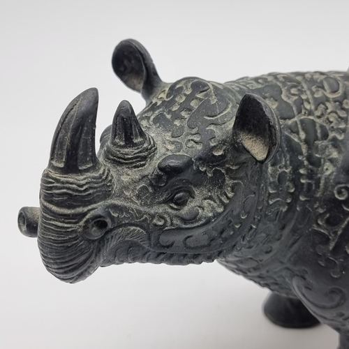 1532 - A Chinese Archaistic style bronze Rhinoceros ritualistic wine vessel, 29.5cm long; together with a C... 