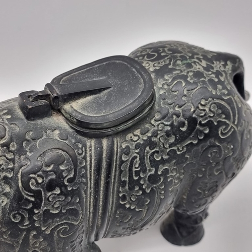 1532 - A Chinese Archaistic style bronze Rhinoceros ritualistic wine vessel, 29.5cm long; together with a C... 
