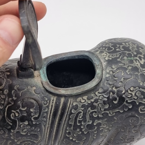 1532 - A Chinese Archaistic style bronze Rhinoceros ritualistic wine vessel, 29.5cm long; together with a C... 