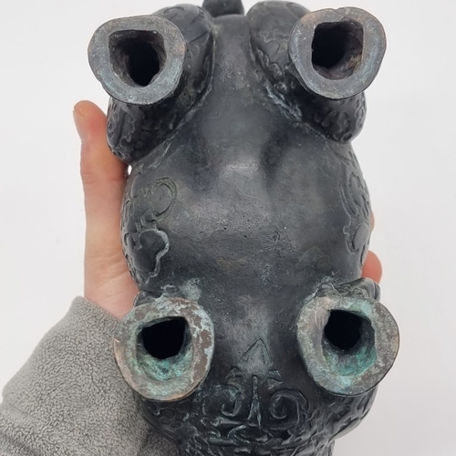 1532 - A Chinese Archaistic style bronze Rhinoceros ritualistic wine vessel, 29.5cm long; together with a C... 