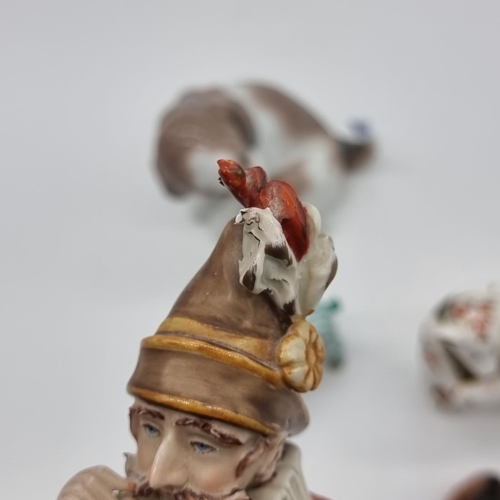 1534 - A mixed group of pottery and porcelain, to include a Capodimonte figure, 25cm high; two Herend pigs,... 