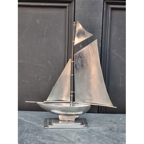 1544 - A vintage chrome yacht, 34cm high; together with a similar BOC soda syphon. (2)
