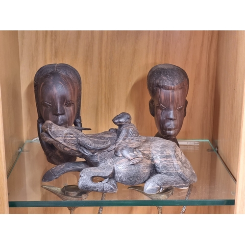 1431 - Ethnographica: a collection of carved ebony busts and similar, largest 25cm high. (5)... 