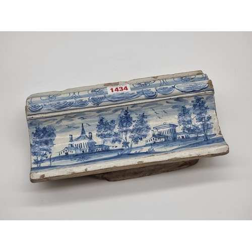 1434 - A Dutch Delft moulded frieze tile, 25cm wide.