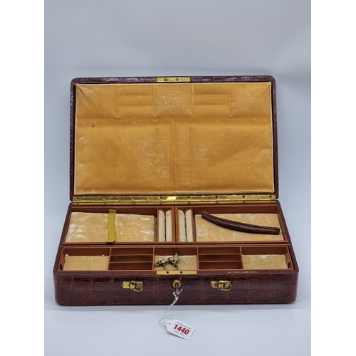 1440 - A crocodile jewellery case, inscribed 'John Bagshaw & Sons, Liverpool', 39cm wide.... 