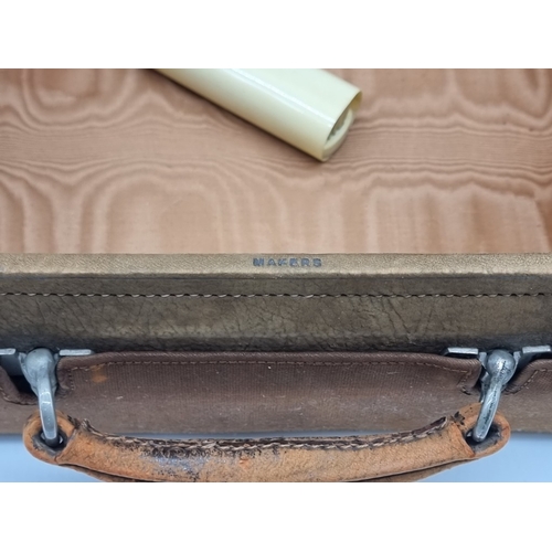 1441 - A leather vanity case, inscribed 'John Bagshaw & Sons, Liverpool', with partial tortoiseshell fi... 