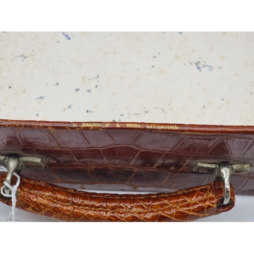 1441 - A leather vanity case, inscribed 'John Bagshaw & Sons, Liverpool', with partial tortoiseshell fi... 