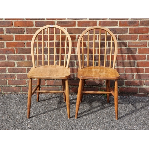 1075 - A rare pair of 1940s Ercol Windsor chairs, one labelled 'B.O.T., Price-Control Mark, Max. Price £2:7... 