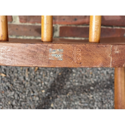 1075 - A rare pair of 1940s Ercol Windsor chairs, one labelled 'B.O.T., Price-Control Mark, Max. Price £2:7... 