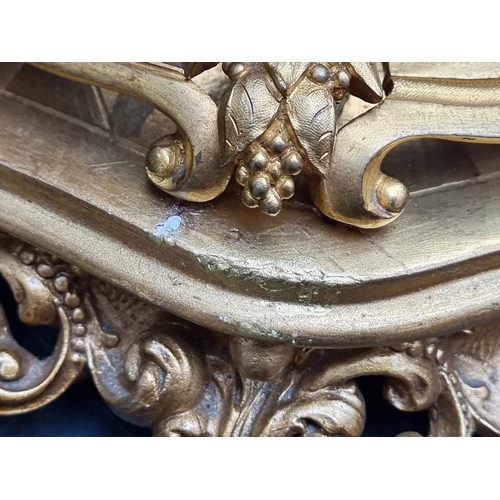 1165 - A Louis XV style gilt metal figural mantel clock, 36.5cm wide, on conforming giltwood stand, total h... 