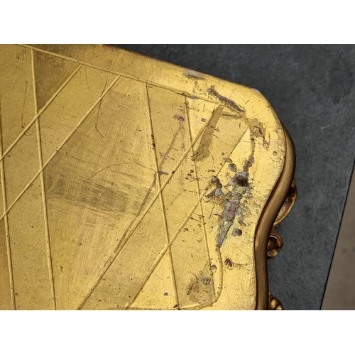 1165 - A Louis XV style gilt metal figural mantel clock, 36.5cm wide, on conforming giltwood stand, total h... 