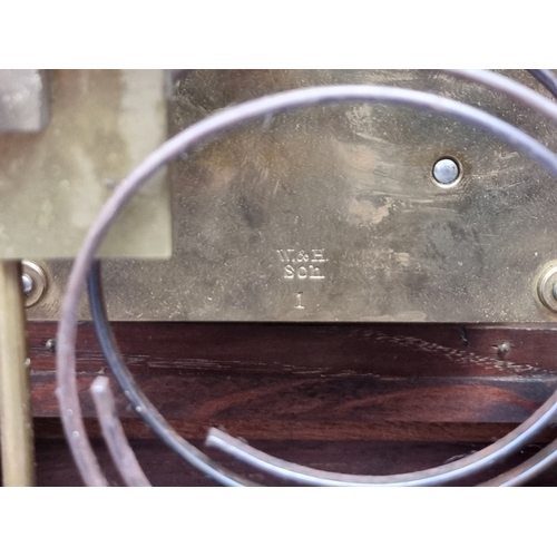 1184 - A late 19th century carved oak mantel clock, 44cm high, with pendulum.