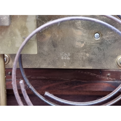 1184 - A late 19th century carved oak mantel clock, 44cm high, with pendulum.