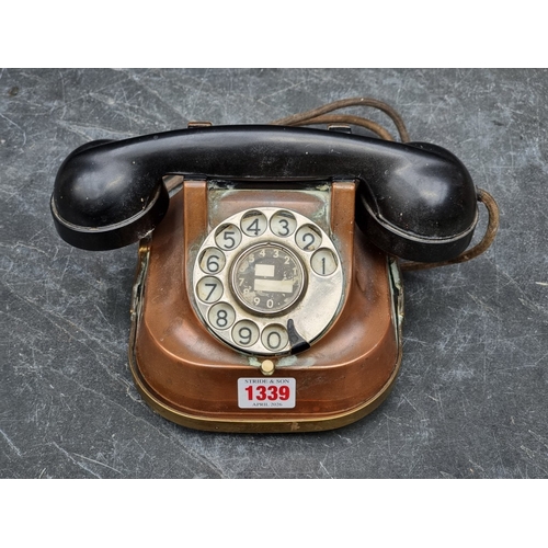 1339 - A vintage copper and Bakelite telephone.